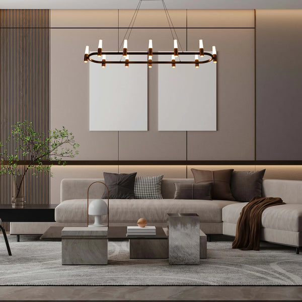 A modern living room is lit by a stunning, elongated oval chandelier. It features minimalist lights on a dark bronze frame.