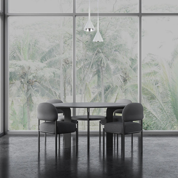Minimalist white pendant lights hang above a modern dining table. Natural light streams in through large windows.