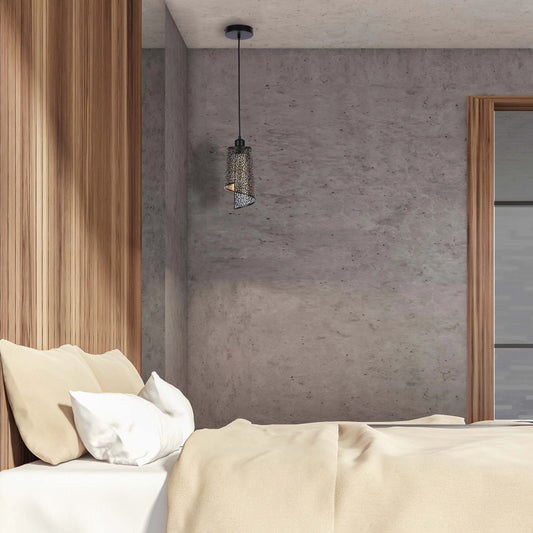 A metal pendant light hangs from the ceiling, casting a warm glow. Natural light filters in from the side.