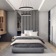 Modern bedroom featuring dual-ring pendant lights, and integrated ceiling lights, creating a bright and contemporary space.