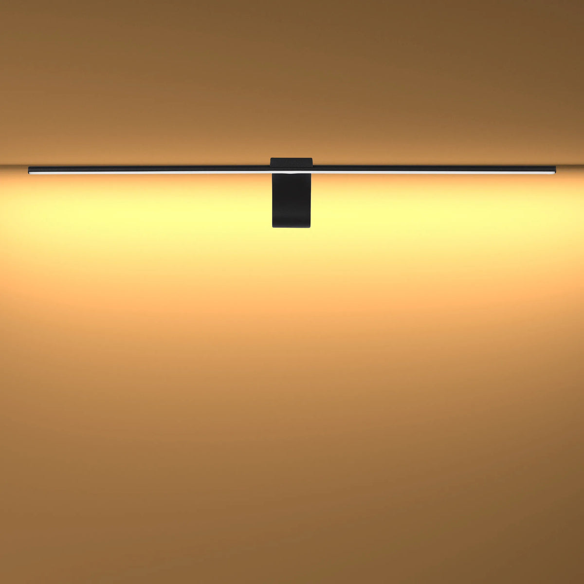 Modern wall light in black, emitting a soft warm glow. Stylish and energy-efficient lighting solution for any room.