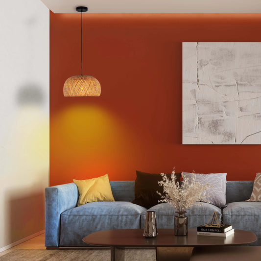 Cosy, warm lighting from a woven pendant lamp creates an inviting ambience in this stylish living room setup.