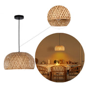A woven rattan pendant light hangs over a dining table, casting a warm glow in the room.