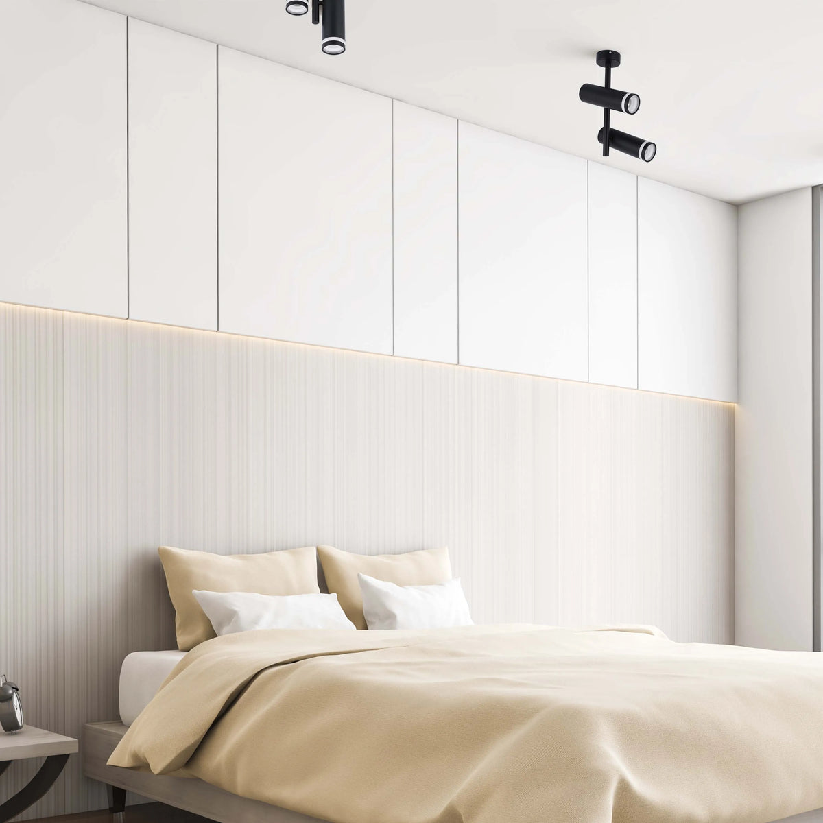 Modern bedroom lighting features black spotlights and a strip light illuminating the textured headboard.