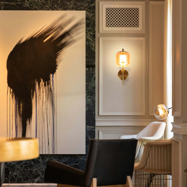 Stylish lighting fixtures on display, including a modern sconce and a globe pendant lamp. Contemporary interior lighting design.