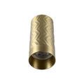 Textured gold wall light, cylindrical in shape with a visible bulb at the bottom. Adds a touch of contemporary glamour to any space.