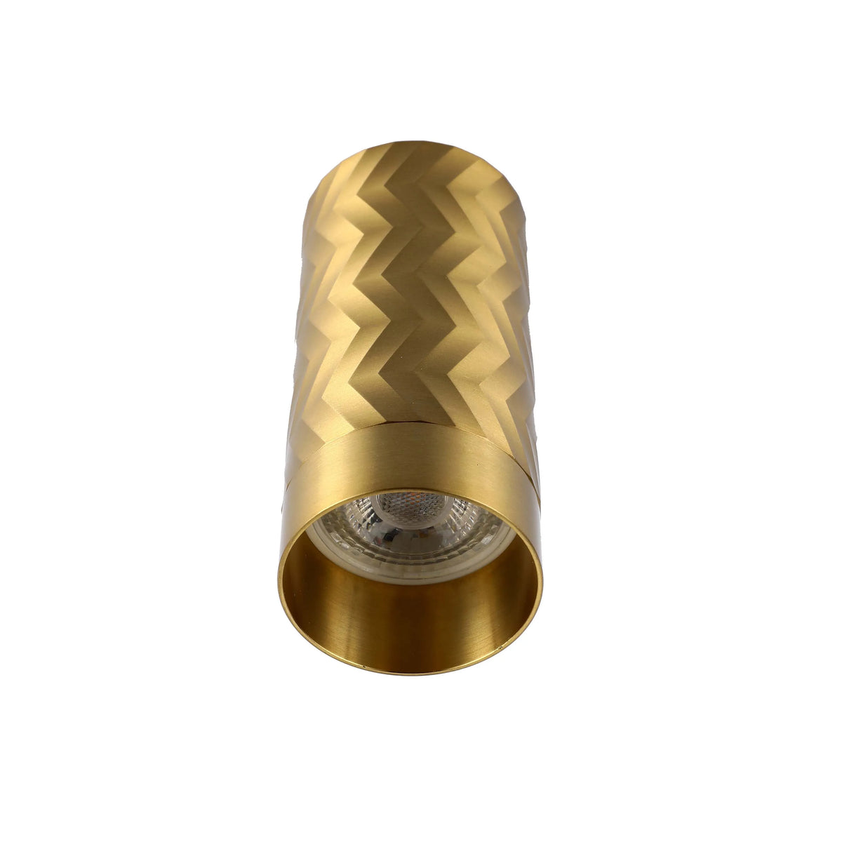 A brushed gold wall light with a cylindrical shape and a geometric, zigzag design.