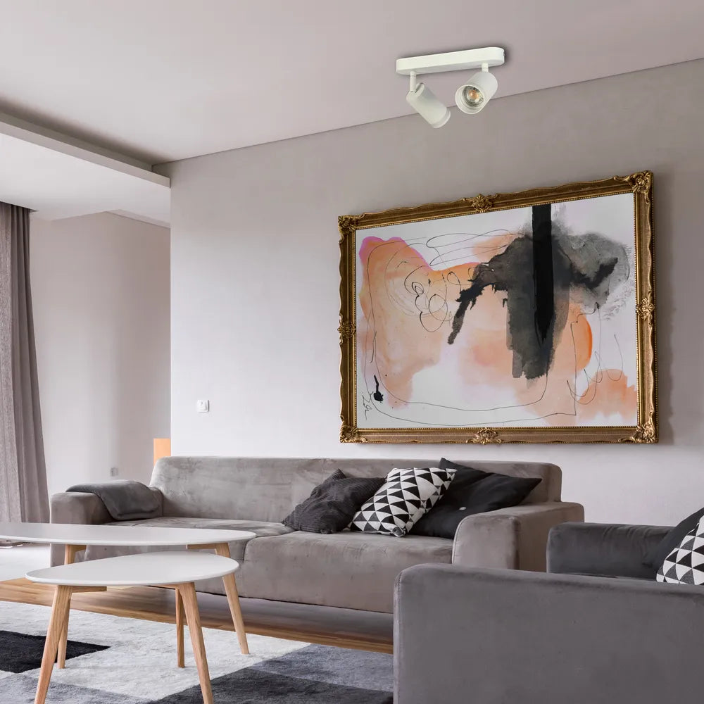 Modern circular GU10 spotlight fixture illuminating a chic living room with minimalist decor, enhancing ambiance and style.172-03035