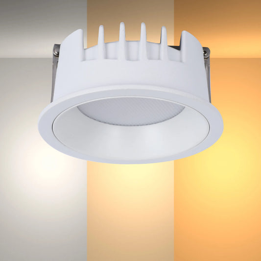 A recessed downlight illuminating various warm colour temperatures, highlighting its adaptability.