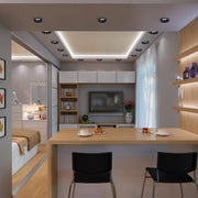 Contemporary lighting design featuring recessed spotlights and strip lights, creating a bright and inviting atmosphere.