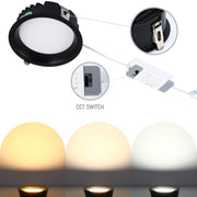 A recessed downlight with a CCT switch showing warm, neutral and cool white light options.
