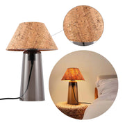 A modern table lamp with a cork shade and grey glass base. Perfect for adding a warm glow to any room.