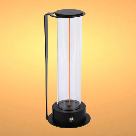A sleek, black lamp with a cylindrical glass shade and a minimalist design, emitting a warm, inviting light.