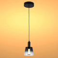 Stylish pendant light with a black finish and a glass shade. Contemporary design for a modern interior.