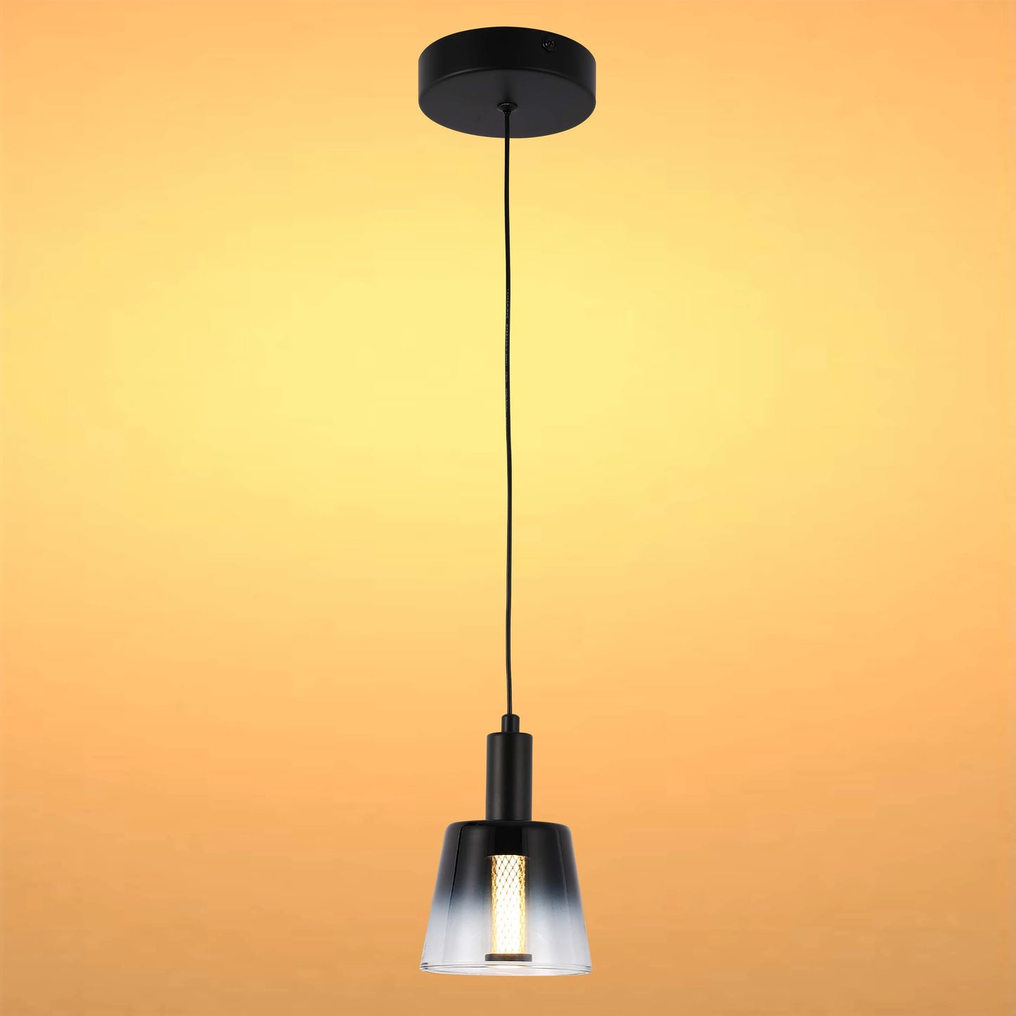 Stylish pendant light with a black finish and a glass shade. Contemporary design for a modern interior.
