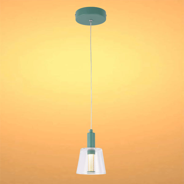 A hanging pendant light with a clear glass shade and a green mount against an orange background.