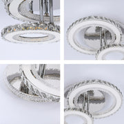 Modern LED ceiling light fixture with crystal detailing, suspended from polished chrome rods.