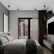 Modern bedroom lighting with recessed ceiling spotlights, creating a bright and inviting atmosphere for relaxing or sleeping.