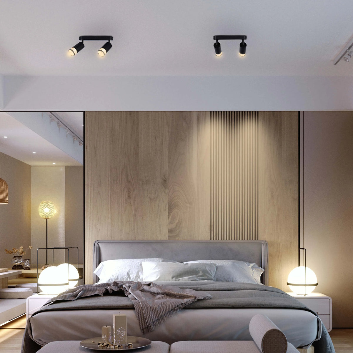 Bedroom with modern ceiling spotlight fixtures and bedside globe lamps providing soft, ambient lighting.