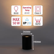 Black cylinder light with icons for bulb, temperature, IP20, GU10, Class II, and max 50W. Height is 80mm and diameter is 60mm.
