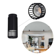 A black, cylindrical, slatted ceiling light feature, with a bright bulb visible through the slats. A close up shows the light's detail.