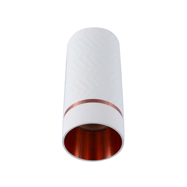 A modern, cylindrical downlight with white patterned exterior and a warm, copper-toned interior. Contemporary and stylish lighting.