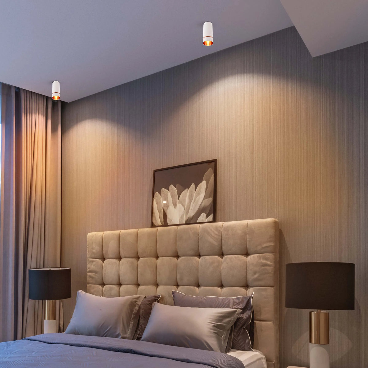 Bedroom lighting features recessed ceiling lights, providing warm illumination. Bedside lamps add a soft glow, complementing the serene ambience.