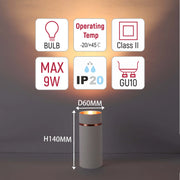 A modern desk lamp on display showcasing its technical specifications like bulb type, dimensions, power and operating temperature.
