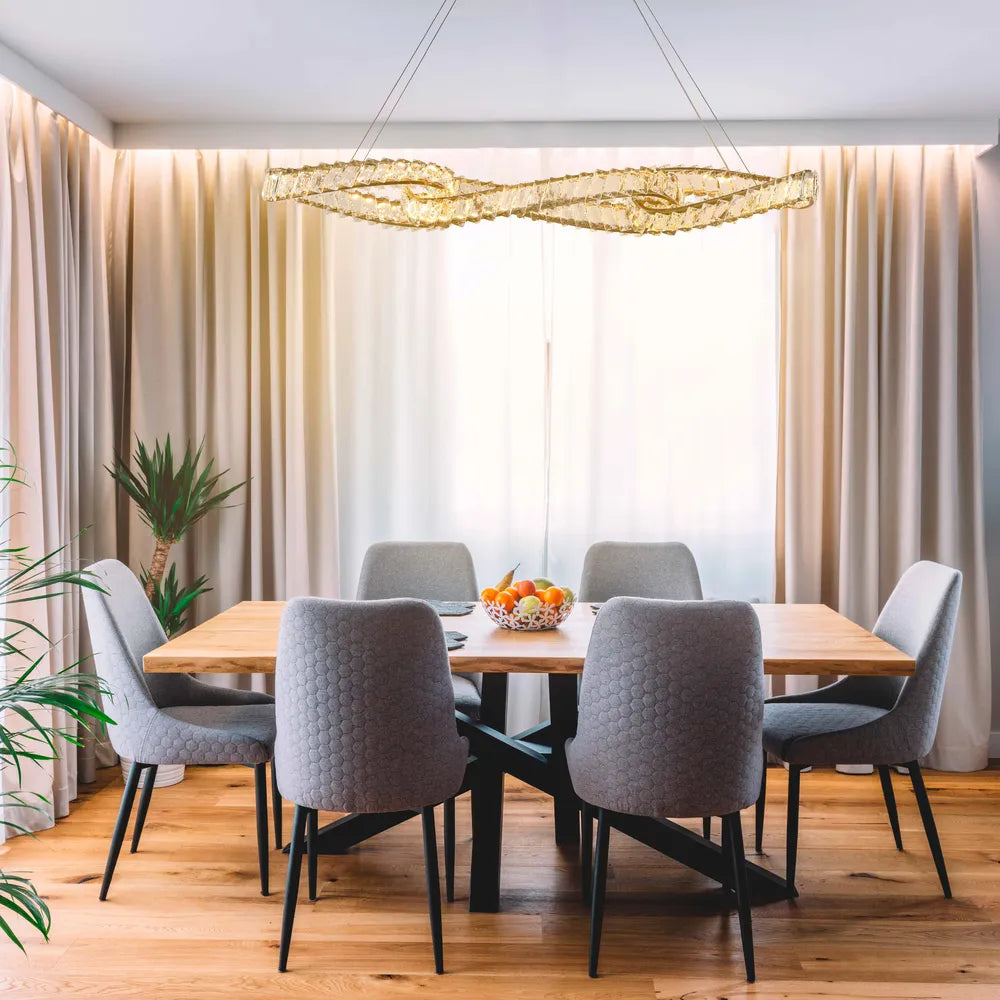 Elegant DNA-inspired crystal chandelier in a modern dining room with copper accents, enhancing luxurious decor and lighting.159-18159