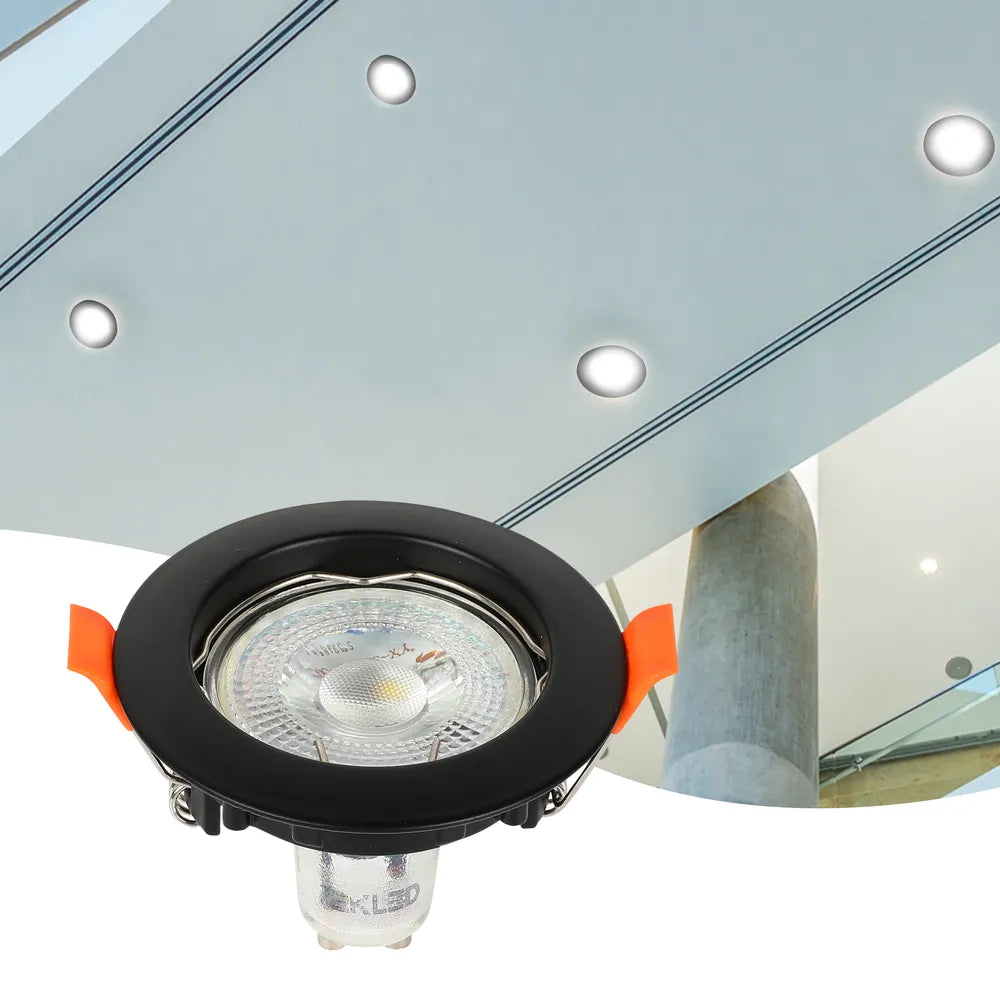 Elegant GU10 downlight fixture illuminates a modern kitchen with sleek cabinetry, enhancing contemporary decor and creating a warm ambiance.143-03990