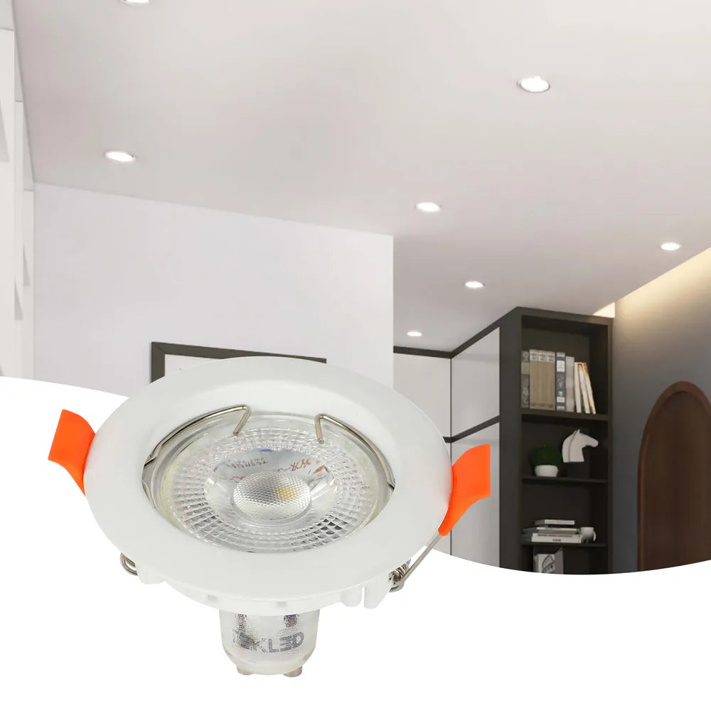 Elegant GU10 downlight fixture illuminating a modern home setting with minimalist decor, enhancing warmth and style in the living area.143-03991