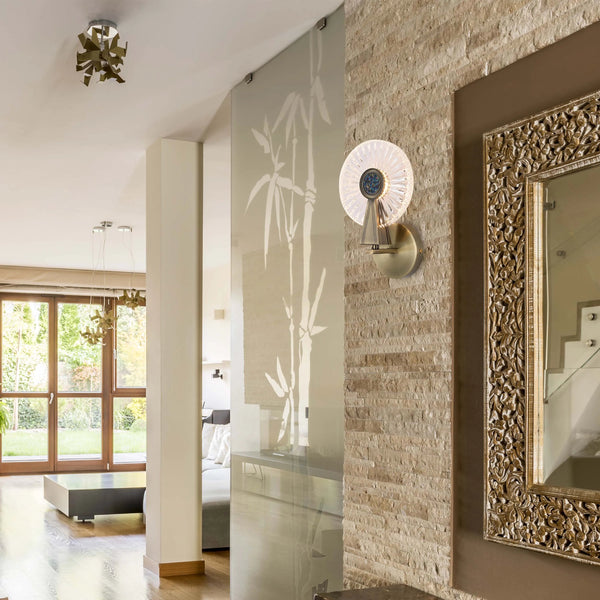 A hallway featuring statement ceiling and wall lights, creating a warm, inviting ambience in this stylish home.