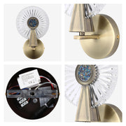A vintage gold wall sconce with a circular glass shade and colourful centrepiece, adding a touch of classic elegance to any space.