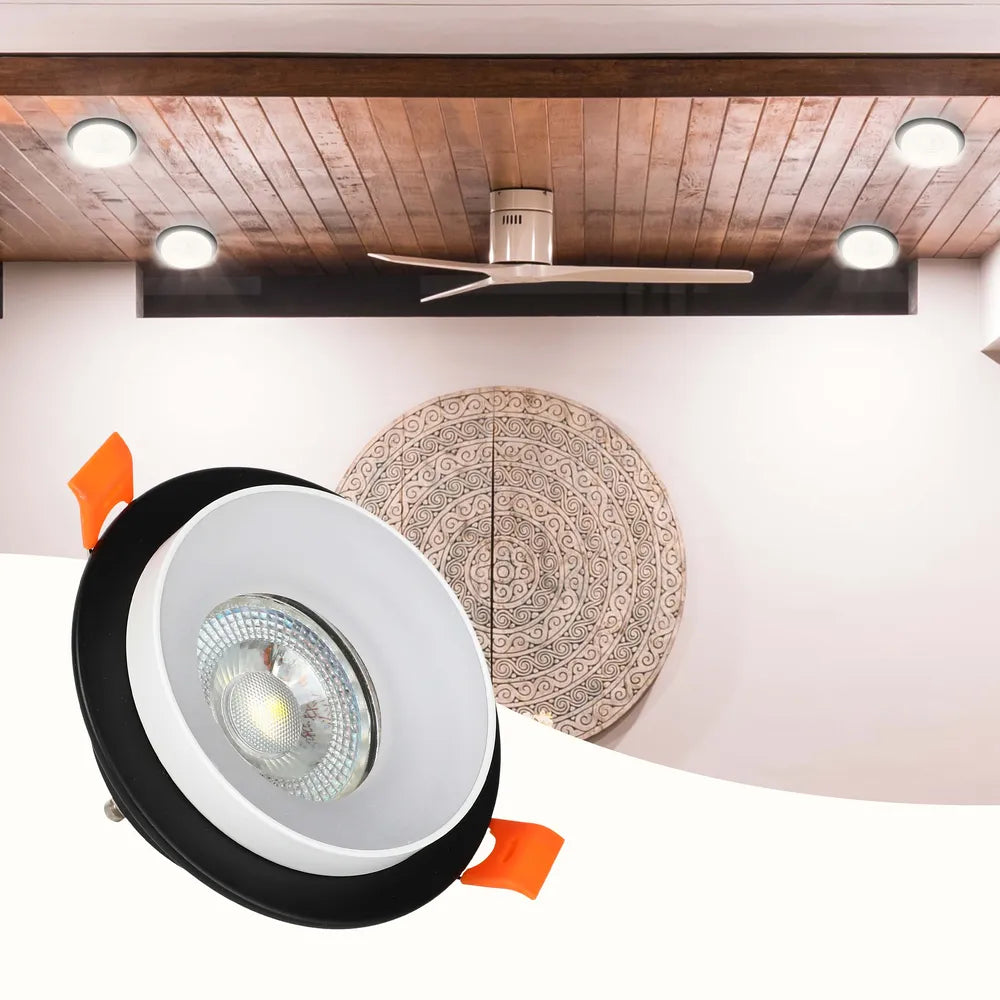 Sleek GU10 downlight fixture illuminates a modern living room with contemporary decor, enhancing ambiance and style.143-03430