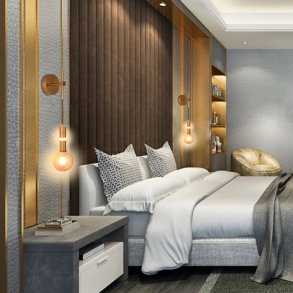 Stylish bedroom with warm, glowing wall lights either side of a padded headboard, creating a cosy and inviting atmosphere.