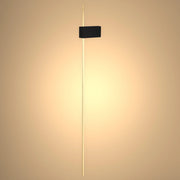 Contemporary wall light featuring a sleek golden rod and black rectangular fixture. Warm, inviting glow creates a modern ambience.