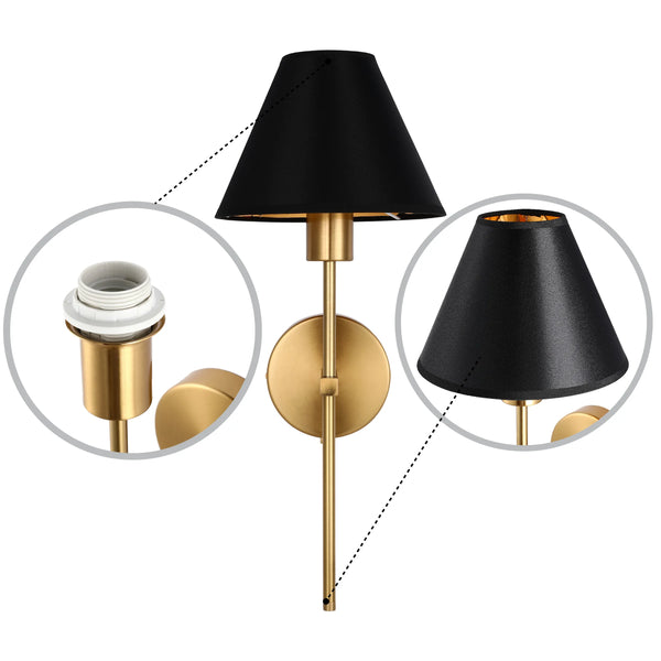 A brushed brass wall lamp with a black fabric shade, with a gold interior, showcasing the lightbulb fixture.