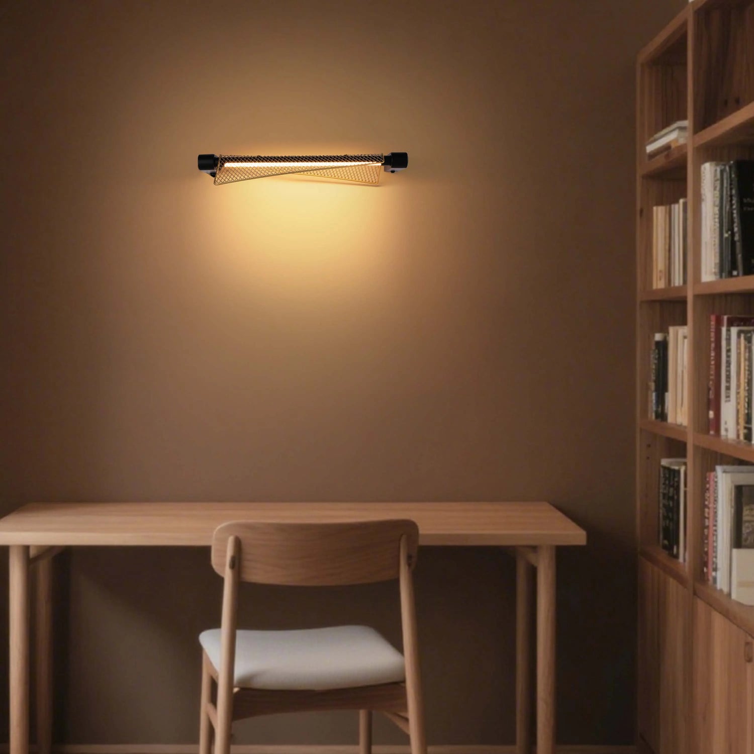 A wall-mounted light provides warm, ambient light above a wooden desk and chair, perfect for a cosy study nook.
