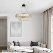 A two-tiered crystal chandelier adds a touch of luxury to this modern living room.
