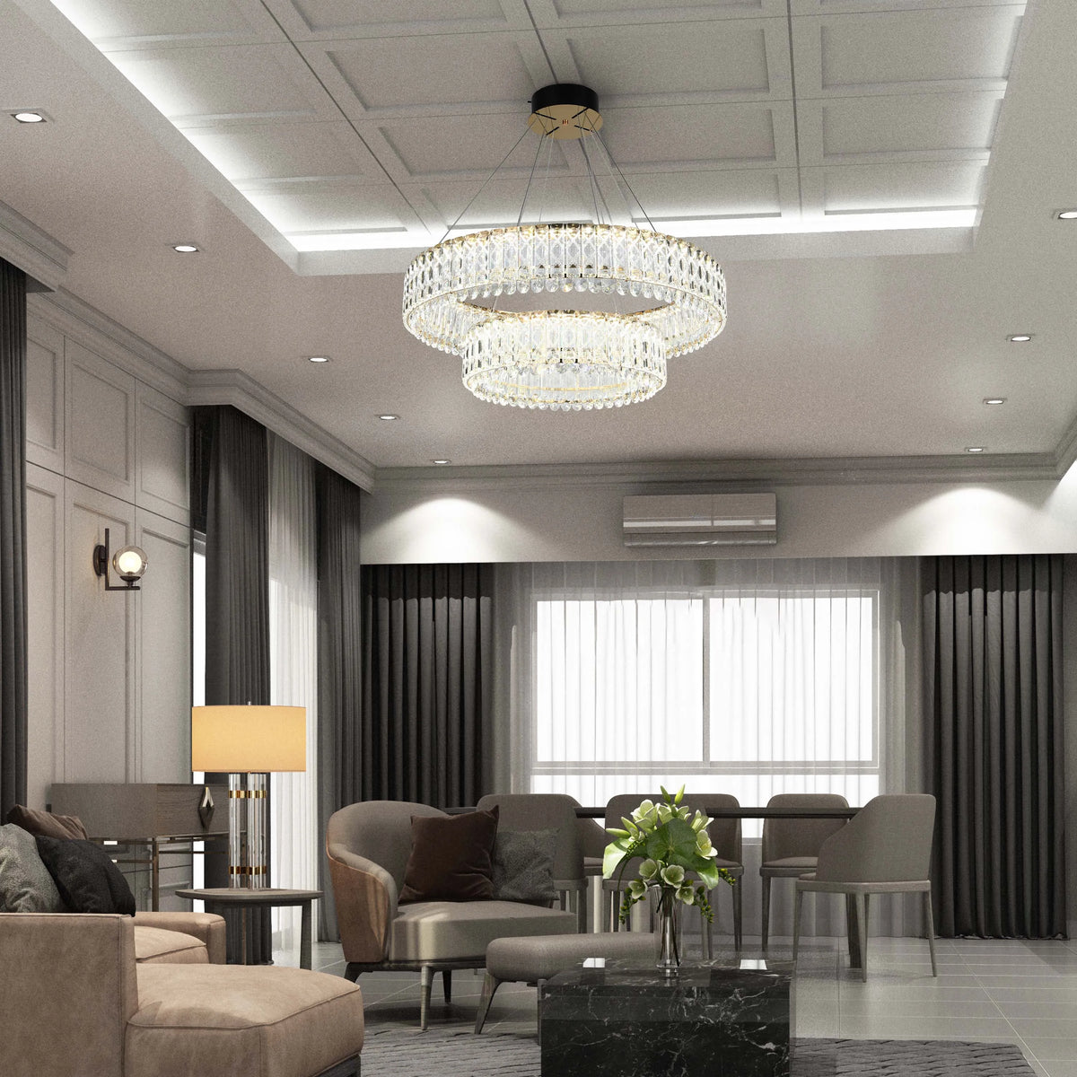 An opulent chandelier and wall sconce provide layered illumination in this elegantly decorated living space.