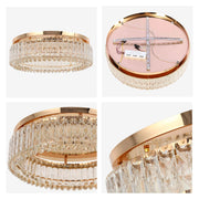 A gold, circular crystal light fixture, offering an elegant, modern touch to any space.