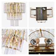 A gold wall light with layered crystal detailing. A luxurious accent light for your living space or bedroom.