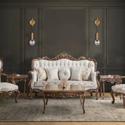 Sconces illuminate the room with warm, ambient light. Their gold finish adds a touch of opulence against the dark walls.