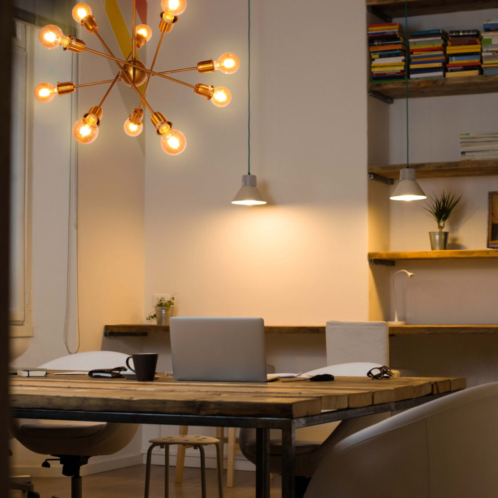 Golden Equilibrium Sphere Sputnik Chandelier | 10-Light Geometric Elegance Fixture with opal bulb | TEKLED 158-19538 is in action over a desk in the library or study room