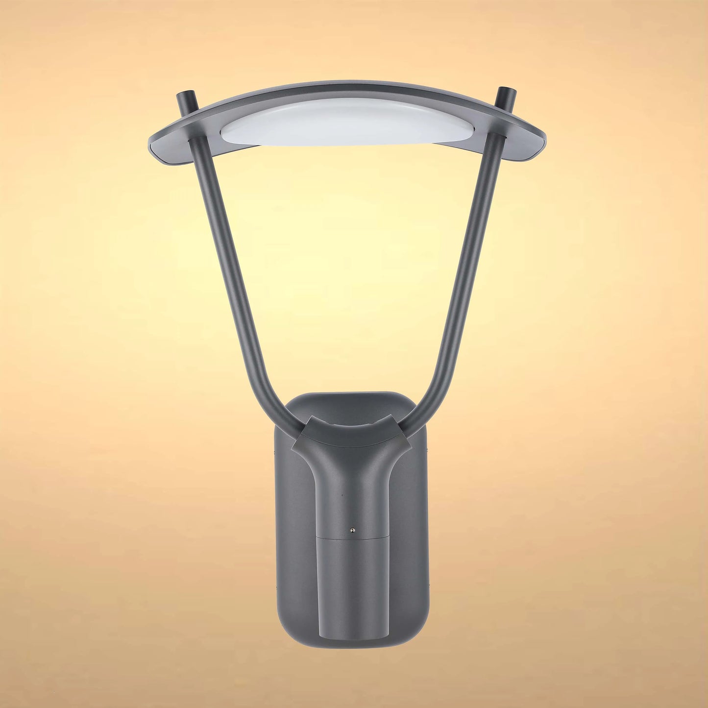 A contemporary outdoor LED wall light with a curved design and a grey finish against a warm yellow backdrop.