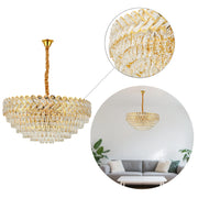 A gold-framed crystal chandelier provides stylish overhead lighting. Its cascading design adds glamour to any room.