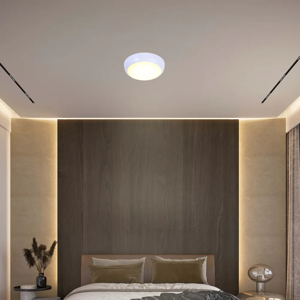 LED flush ceiling light in a modern hallway with sleek decor, featuring a white rim and versatile lighting options for ambiance.118-03620