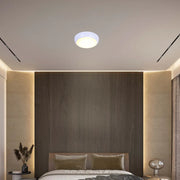 LED flush ceiling light in a modern hallway with sleek decor, featuring a white rim and versatile lighting options for ambiance.118-03620