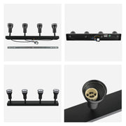A matt black, four-bulb spotlight fitting, showcasing a modern lighting fixture with directional heads.