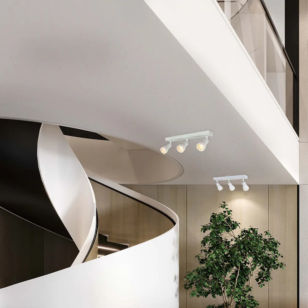 Luma Cylindro GU10 spotlight fixture highlighting a modern living room with sleek decor and ambient lighting. Ideal for stylish illumination.172-03220